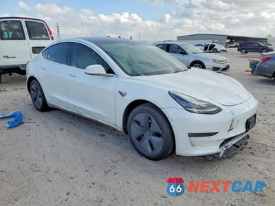Czwarte zdjęcie samochodu z boku: 2019 TESLA MODEL 3 VIN:5YJ3E1EB8KF192318 - miniatura