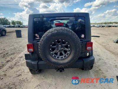 Zdjęcie 6 z 12 samochodu: 2011 JEEP WRANGLER UNLIMITED RUBICON VIN:1J4HA6H13BL585863 - miniatura