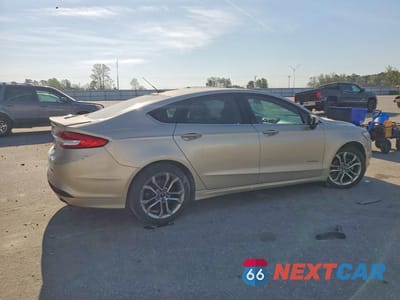 Trzecie zdjęcie samochodu z tyłu: 2017 FORD FUSION SE HYBRID VIN:3FA6P0LUXHR357059 - miniatura