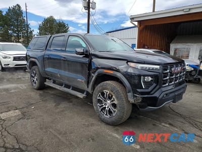 Czwarte zdjęcie samochodu z boku: 2023 GMC CANYON AT4 VIN:1GTP6DEK5P1174570 - miniatura