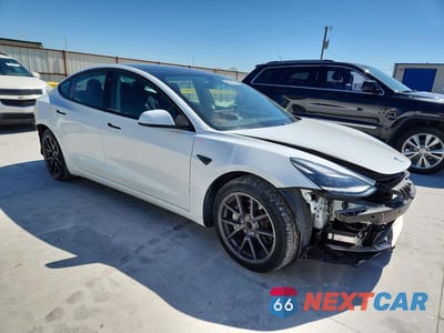 Czwarte zdjęcie samochodu z boku: 2021 TESLA MODEL 3 VIN:5YJ3E1EA7MF017049 - miniatura