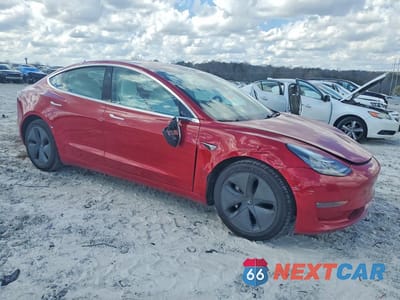 Czwarte zdjęcie samochodu z boku: 2018 TESLA MODEL 3 VIN:5YJ3E1EB2JF075106 - miniatura