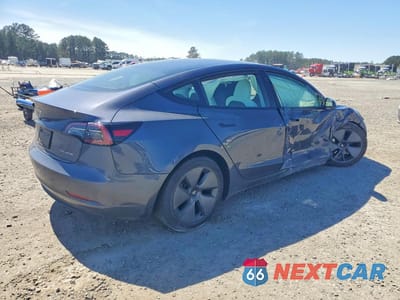 Trzecie zdjęcie samochodu z tyłu: 2023 TESLA MODEL 3 VIN:5YJ3E1EB0PF680038 - miniatura