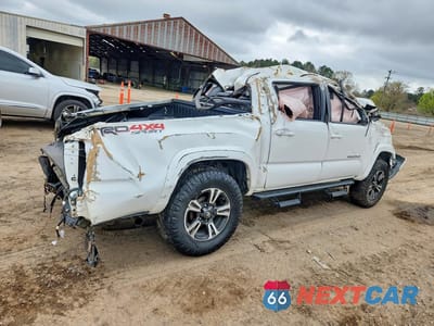 Trzecie zdjęcie samochodu z tyłu: 2019 TOYOTA TACOMA TRD SPORT VIN:3TMCZ5AN6KM208006 - miniatura