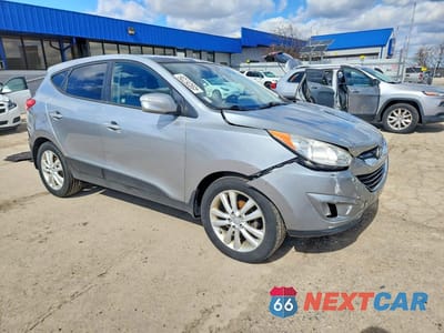 Czwarte zdjęcie samochodu z boku: 2011 HYUNDAI TUCSON LIMITED VIN:KM8JU3AC4BU140711 - miniatura