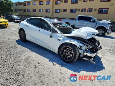 Czwarte zdjęcie samochodu z boku: 2022 TESLA MODEL 3 VIN:5YJ3E1EA8NF318818 - miniatura