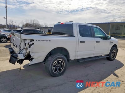 Trzecie zdjęcie samochodu z tyłu: 2022 FORD F150 LIGHTNING PRO VIN:1FTVW1EL1NWG14881 - miniatura