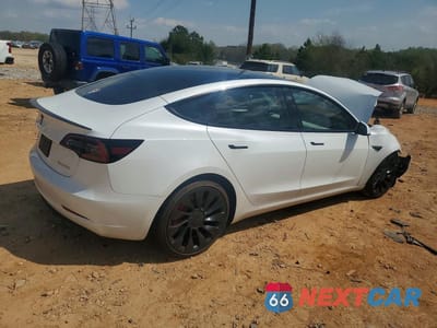 Trzecie zdjęcie samochodu z tyłu: 2023 TESLA MODEL 3 VIN:5YJ3E1EC5PF477252 - miniatura