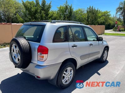 Czwarte zdjęcie samochodu z boku: 2003 TOYOTA RAV4 BASE VIN:JTEGH20V930118398 - miniatura