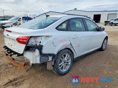 Trzecie zdjęcie samochodu z tyłu: 2017 FORD FOCUS SE VIN:1FADP3F28HL335661 - miniatura