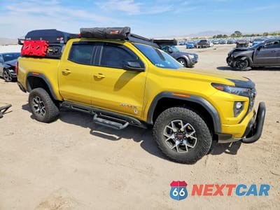 Czwarte zdjęcie samochodu z boku: 2023 GMC CANYON AT4X VIN:1GTP6EEK9P1265475 - miniatura