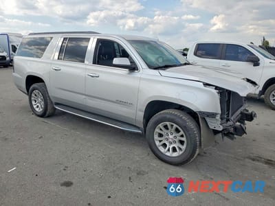 Czwarte zdjęcie samochodu z boku: 2019 GMC YUKON XL C1500 SLT VIN:1GKS1GKCXKR389982 - miniatura
