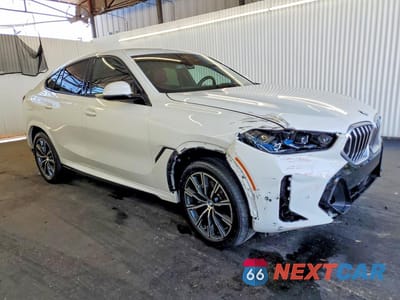 Czwarte zdjęcie samochodu z boku: 2026 BMW X6 XDRIVE40I VIN:5UX33EX02T9135471 - miniatura