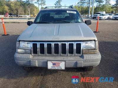 Piąte zdjęcie samochodu w środku: 1997 JEEP GRAND CHEROKEE LAREDO VIN:1J4FX58SXVC540397 - miniatura