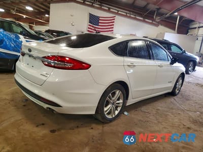 Trzecie zdjęcie samochodu z tyłu: 2018 FORD FUSION SE HYBRID VIN:3FA6P0LU9JR269030 - miniatura