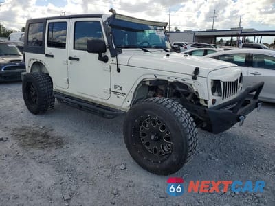 Czwarte zdjęcie samochodu z boku: 2009 JEEP WRANGLER UNLIMITED X VIN:1J4GA39139L770935 - miniatura