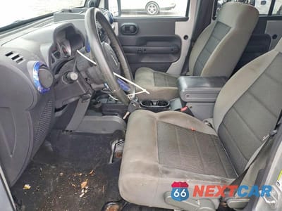 Zdjęcie 7 z 11 samochodu: 2010 JEEP WRANGLER UNLIMITED SAHARA VIN:1J4BA5H16AL101702 - miniatura