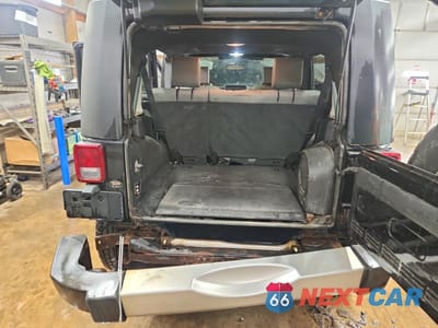 Zdjęcie 6 z 13 samochodu: 2009 JEEP WRANGLER UNLIMITED SAHARA VIN:1J4GA59149L749734 - miniatura
