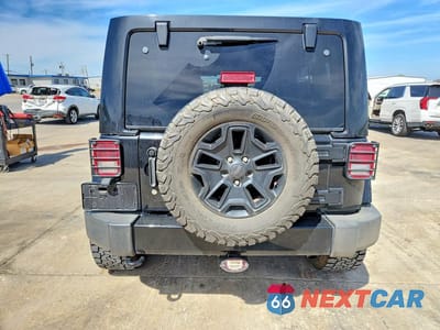 Zdjęcie 6 z 11 samochodu: 2016 JEEP WRANGLER UNLIMITED SAHARA VIN:1C4BJWEG8GL163812 - miniatura