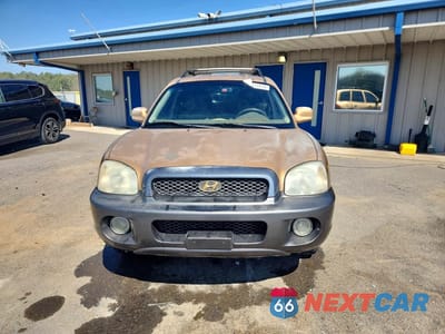 Piąte zdjęcie samochodu w środku: 2004 HYUNDAI SANTA FE GLS VIN:KM8SC13D04U593034 - miniatura