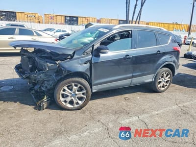 2014 FORD ESCAPE TITANIUM 1FMCU0J90EUA07704 - główne zdjęcie licytacji z USA - miniatura