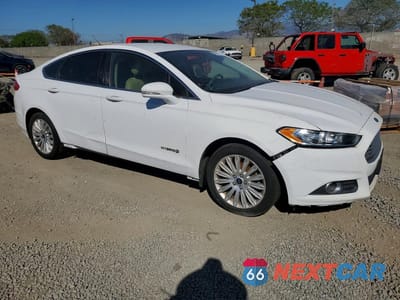Czwarte zdjęcie samochodu z boku: 2016 FORD FUSION SE HYBRID VIN:3FA6P0LU9GR389354 - miniatura