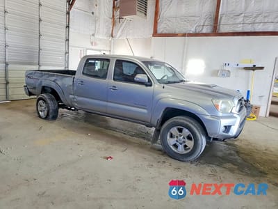 Czwarte zdjęcie samochodu z boku: 2014 TOYOTA TACOMA V6 VIN:3TMMU4FN7EM070700 - miniatura