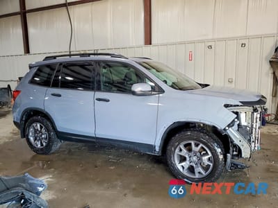 Czwarte zdjęcie samochodu z boku: 2022 HONDA PASSPORT EXL VIN:5FNYF8H50NB025540 - miniatura