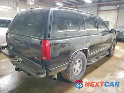 Trzecie zdjęcie samochodu z tyłu: 1999 GMC YUKON VIN:1GKEC13R9XJ793112 - miniatura