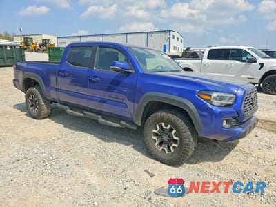 Czwarte zdjęcie samochodu z boku: 2022 TOYOTA TACOMA TRD OFF-ROAD VIN:3TMDZ5BN4NM131191 - miniatura