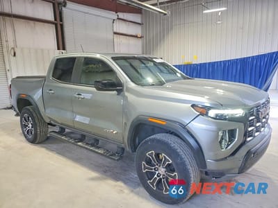 Czwarte zdjęcie samochodu z boku: 2023 GMC CANYON AT4 VIN:1GTP6DEK8P1151722 - miniatura