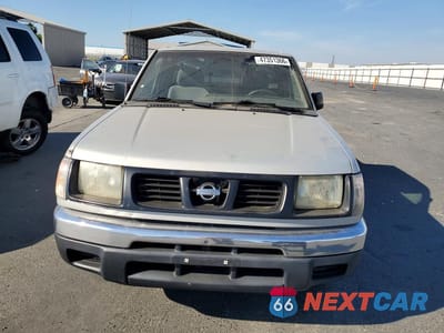 Piąte zdjęcie samochodu w środku: 1999 NISSAN FRONTIER XE VIN:1N6DD26S3XC318209 - miniatura