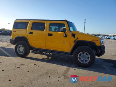 Czwarte zdjęcie samochodu z boku: 2003 HUMMER H2 VIN:5GRGN23U63H107830 - miniatura