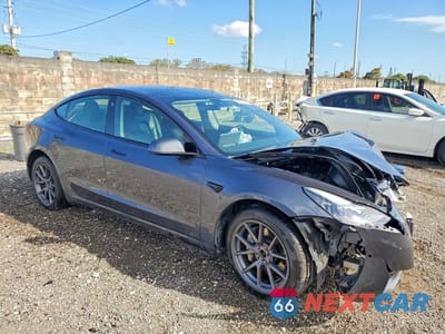 Czwarte zdjęcie samochodu z boku: 2022 TESLA MODEL 3 VIN:5YJ3E1EB0NF288321 - miniatura