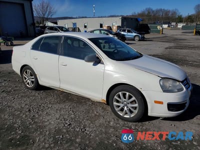 Czwarte zdjęcie samochodu z boku: 2009 VOLKSWAGEN JETTA VIN:3VWAL7AJ7AM028918 - miniatura