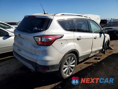 Trzecie zdjęcie samochodu z tyłu: 2018 FORD ESCAPE TITANIUM VIN:1FMCU9J98JUC11469 - miniatura