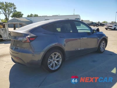 Trzecie zdjęcie samochodu z tyłu: 2023 TESLA MODEL Y VIN:7SAYGAEE4PF773982 - miniatura