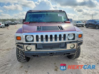 Piąte zdjęcie samochodu w środku: 2004 HUMMER H2 VIN:5GRGN23U64H104704 - miniatura