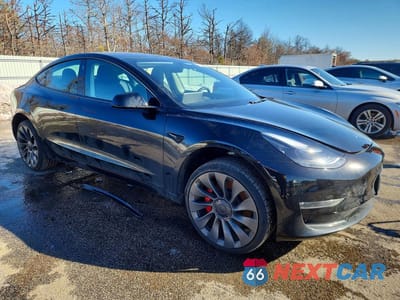 Czwarte zdjęcie samochodu z boku: 2023 TESLA MODEL 3 VIN:5YJ3E1EC1PF507217 - miniatura