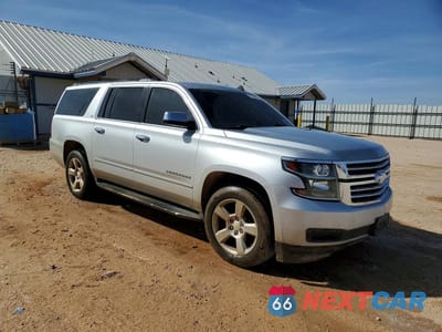Czwarte zdjęcie samochodu z boku: 2015 CHEVROLET SUBURBAN C1500 LT VIN:1GNSCJKC9FR290067 - miniatura