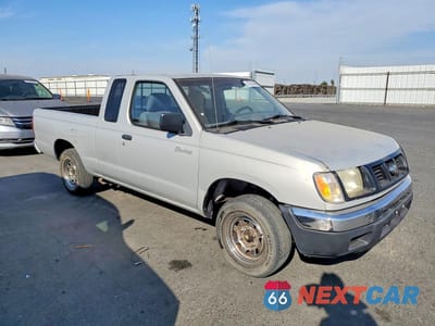 Czwarte zdjęcie samochodu z boku: 1999 NISSAN FRONTIER XE VIN:1N6DD26S3XC318209 - miniatura