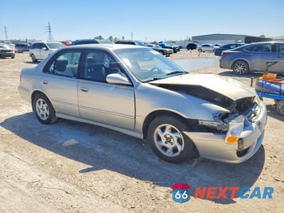 Czwarte zdjęcie samochodu z boku: 2002 TOYOTA COROLLA S VIN:1NXBR12E72Z629341 - miniatura