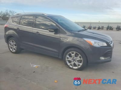 Czwarte zdjęcie samochodu z boku: 2016 FORD ESCAPE TITANIUM VIN:1FMCU9JX5GUB54669 - miniatura