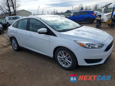 Czwarte zdjęcie samochodu z boku: 2017 FORD FOCUS SE VIN:1FADP3F28HL335661 - miniatura