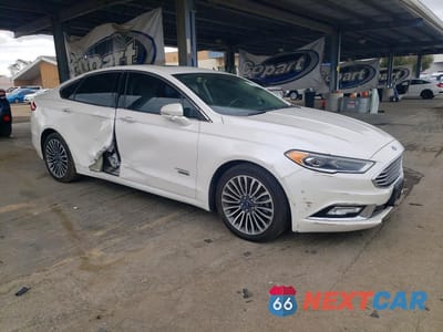 Czwarte zdjęcie samochodu z boku: 2017 FORD FUSION TITANIUM PHEV VIN:3FA6P0SU0HR141965 - miniatura