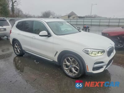 Czwarte zdjęcie samochodu z boku: 2021 BMW X3 XDRIVE30E VIN:5UXTS1C00M9H70629 - miniatura