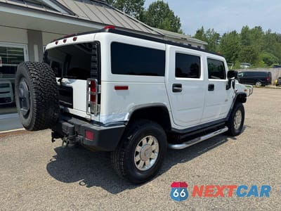 Czwarte zdjęcie samochodu z boku: 2006 HUMMER H2 VIN:5GRGN23U06H106175 - miniatura