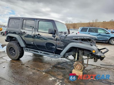 Czwarte zdjęcie samochodu z boku: 2011 JEEP WRANGLER UNLIMITED RUBICON VIN:1J4HA6H11BL500695 - miniatura