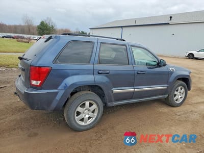 Trzecie zdjęcie samochodu z tyłu: 2010 JEEP GRAND CHEROKEE LAREDO VIN:1J4PR4GK1AC138093 - miniatura