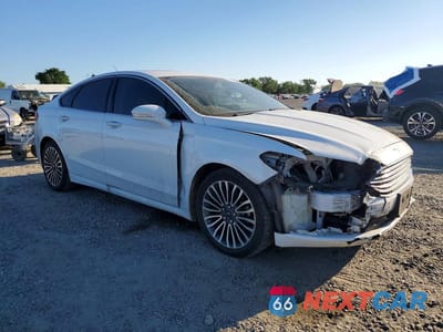 Czwarte zdjęcie samochodu z boku: 2017 FORD FUSION TITANIUM VIN:3FA6P0K90HR111120 - miniatura